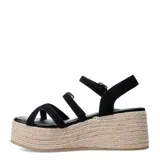 Sandalias de plataforma Miss Carol Corena color negro, con múltiples tiras finas, hebillas metálicas regulables y suela revestida en yute tipo espadrille.