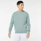 Sweater de punto con textura fantasía, cuello redondo y mangas largas con puños acanalados.