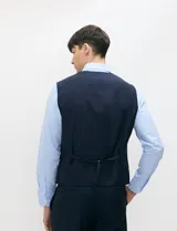 Chaleco formal sastrero Harrington Select de color azul marino, con cuello en V, cierre frontal de botones y bolsillos ribeteados.