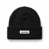 Gorro de lana negro tipo beanie con vuelta y etiqueta frontal con la inscripción "Board Brand Community".
