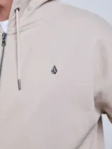 Campera con capucha Volcom modelo Lowtone, color beige, con cierre frontal completo, cordones ajustables y pequeño logo bordado en el pecho.