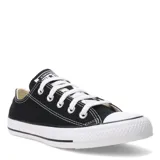 Championes de lona Converse modelo Chuck Taylor All Star, de corte bajo, color negro con puntera y suela de goma blanca.