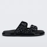 Sandalias de plataforma plana Melissa Possession Slip color negro, de diseño moderno y práctico, con tiras anchas texturizadas y hebillas decorativas, elaboradas en material sintético flexible tipo gelatina.