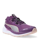 Championes de running Puma modelo Reflect Lite, color violeta con detalles en plateado y suela en tono rosado claro. Presentan una parte superior de malla y material sintético, con tecnología de entresuela de espuma EVA PUMALite para mayor amortiguación y suela de goma Protread para tracción en diversos terrenos.
