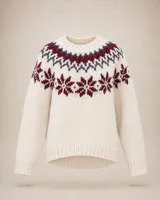Buzo de lana merino con diseño de tejido nórdico en el canesú, cuello redondo y mangas largas con puños acanalados.