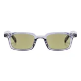 Lentes de sol Copenhague con armazón rectangular de acetato transparente en tono grisáceo y cristales tintados en color verde claro.