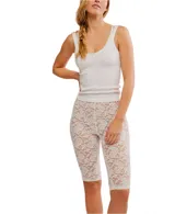 Calzas capri de encaje floral color blanco.