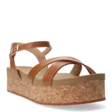 Sandalias de plataforma Bottero en color marrón caramelo, con tiras cruzadas en el empeine y pulsera ajustable al tobillo con hebilla metálica. La base de la plataforma presenta un acabado texturizado tipo corcho.