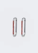 Par de aros tipo argolla de acero quirúrgico dorado con zirconias rojas.