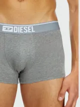 Pack de tres bóxers Diesel de corte ajustado, confeccionados en algodón gris melange, con cintura elástica ancha en color gris claro que presenta el logo de la marca en blanco.