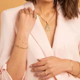 Pulsera de eslabones intercalados en oro amarillo y oro blanco de 9k, con diseño de cadena clásica.