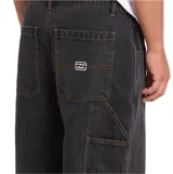 Pantalón de jean Billabong modelo Bad Dog, color negro, de corte holgado y estilo carpintero.