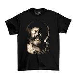 Remera negra de algodón con estampa frontal en tonos sepia que representa el rostro del músico uruguayo Rubén Rada.