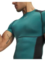 Remera térmica deportiva Under Armour HeatGear Elite de manga corta, con diseño ajustado de compresión en color verde azulado y paneles negros en los hombros y laterales. Cuenta con cuello redondo y el logo de la marca en el pecho.