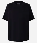 Remera boxy de manga corta y cuello redondo, confeccionada en algodón liso negro de corte holgado.