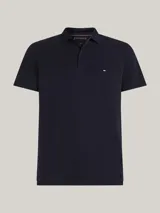 Chomba Tommy Hilfiger color azul marino de piqué de algodón elástico, con cuello clásico, tapeta de dos botones y logo bordado en el pecho.