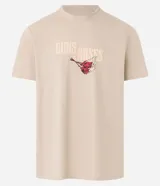 Remera de algodón color beige, corte comfort, con cuello redondo y manga corta. Presenta un gran estampado trasero de un águila con alas abiertas, sosteniendo una cinta roja con el texto "DESTRUCTION FOR APPETITE" y el logo de Guns N' Roses en la parte superior.