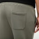 Pantalón de jogging verde de felpa cálida con bolsillos laterales y corte recto.