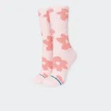 Medias de caña alta color rosa claro con estampado de flores rosas.