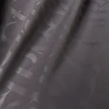 Camiseta de fútbol Adidas del Real Madrid, modelo Tercer Uniforme. Diseño gris con cuello polo, logo de Adidas y escudo del club en blanco. Estampado frontal con el sponsor Emirates Fly Better.