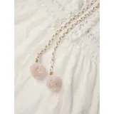 Vestido largo de encaje calado color blanco, con diseño de falda irregular más corta adelante. Presenta escote en V con cordones decorativos y borlas, tirantes finos y detalle de cintura marcada.