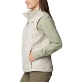 Chaleco acolchado Columbia Heavenly II, color gris claro, con cierre frontal de dos vías, cuello alto forrado en felpa y bolsillos laterales con cierre. Presenta tecnología Omni-Heat™ para retención de calor y Omni-Shield™ para repeler humedad.