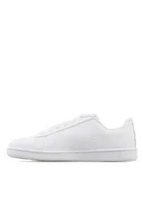 Championes deportivos Puma Up para hombre, de color blanco con la característica franja lateral en negro y el logo de la marca en el lateral y la lengüeta.
