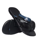 Sandalias tipo ojotas Havaianas modelo Power 2.0, color negro con detalles en rojo. Presentan una suela con textura antideslizante y tiras anchas con diseño geométrico y logo de la marca en relieve.