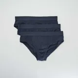 Pack de tres slips lisos de algodón color azul marino con cintura elástica.