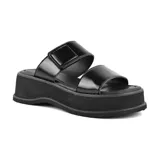 Sandalias negras de cuero sintético con plataforma y doble tira, una con ajuste de velcro.