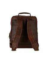 Mochila unisex de cuero natural color marrón, con diseño estructurado, cierre de cremallera, bolsillos frontales con broche y compartimento acolchado para laptop de 15 pulgadas.