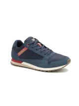 Championes Caterpillar modelo Ventura, de diseño urbano y casual. Confeccionados en una combinación de gamuza y malla técnica en color azul, con detalles en rojo y beige en la entresuela. Presentan el logo de la marca en el lateral y la lengüeta, con suela de goma para mayor tracción.