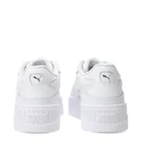 Championes urbanos Puma modelo Karmen II Idol, color blanco, con diseño de plataforma alta y suela dentada. Presentan el logo de la marca en el lateral y en la lengüeta.