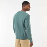 Sweater de punto fino con cuello redondo, manga larga y puños acanalados, de diseño liso y corte estándar.