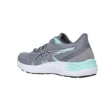 Championes de running Asics modelo Gel-Excite 8, color negro con detalles en lila y blanco. Presentan tecnología AmpliFoam en la entresuela para mayor amortiguación y diseño de malla transpirable.