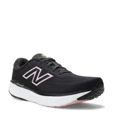 Championes de running New Balance Fresh Foam Evoz para mujer, color negro con el logotipo lateral y detalles en rosado, entresuela blanca y suela con amortiguación.