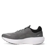 Championes de running Puma Scend Pro, color negro con detalles en blanco. Presentan una capellada de malla transpirable, cordones negros y una suela gruesa de espuma blanca con detalles negros en la parte inferior. En la lengüeta se lee 'PROSET'.