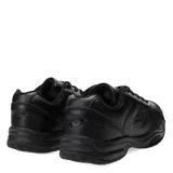 Championes deportivos Lotto de cuero sintético color negro, con cordones al tono, suela de goma resistente y detalles perforados en la puntera y laterales.