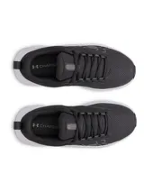 Championes Under Armour modelo W Surge 5, color negro con suela blanca, confeccionados con malla transpirable y entresuela de amortiguación.