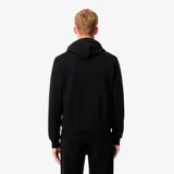Campera con capucha Lacoste, color negro, con cierre frontal completo, bolsillos tipo canguro y logo de la marca bordado en el pecho.