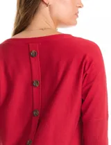 Buzo de tejido fino con cuello redondo, manga tres cuartos con puños acanalados y detalle de pespunte vertical en el frente. Presenta un diseño liso con aplique de botones en la espalda.