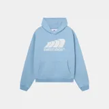 Hoodie oversized de color celeste, con capucha, bolsillo tipo canguro y estampado frontal en color blanco de la marca Eme Studios.