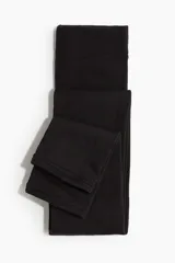 Leggings opacas de color negro con interior en tejido polar termoaislante, diseñadas con cintura y bajos elásticos para mayor ajuste y comodidad.