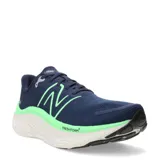 Championes New Balance Running Course, color azul marino con detalles en verde y suela blanca.