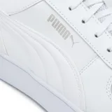 Championes Puma Caven Wns de cuero sintético color blanco con logo plateado en el lateral y perforaciones en la puntera.