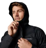 Campera impermeable Columbia modelo Watertight II, color negro, con capucha ajustable, cierre frontal, bolsillos laterales con cremallera y puños ajustables. Cuenta con tecnología Omni-Tech para mayor protección contra la humedad y forro de malla transpirable.