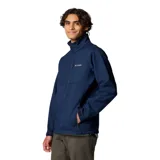 Chaqueta Columbia modelo Ascender Soft Shell, color azul marino, con cuello alto, cierre frontal completo, bolsillo en el pecho y bolsillos laterales con cierre. Presenta puños ajustables y logo de la marca bordado en el pecho.