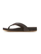 Sandalias tipo ojota de cuero marrón con tiras anchas y suela de goma antideslizante.