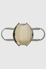 Bolso tipo shopper de diseño rectangular y amplio, confeccionado en tela con patrón de rayas verticales en color blanco y negro. Cuenta con dos asas superiores para llevar al hombro y detalle de aplique metálico con monograma en el centro.