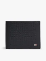 Billetera mini Tommy Hilfiger de cuero azul marino con acabado emboss de monograma TH, diseño compacto con ranuras para tarjetas y placa metálica con el logo de la marca.